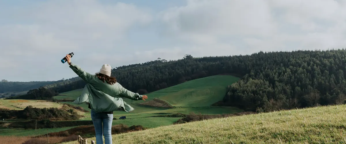ESRS-40a for UK parent groups — a walker open-armed in an open field, a third-country parent caught on EU turnover alone