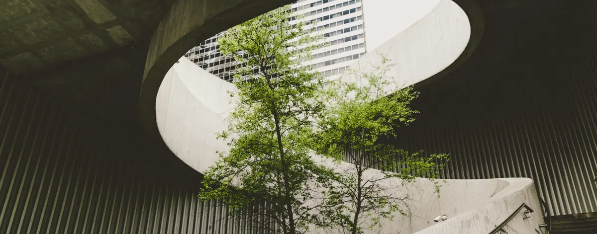 GHG reporting software and organisational boundaries — a tree growing through corporate concrete, equity share against financial and operational control