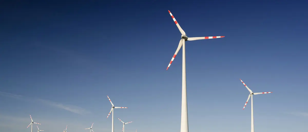SECR requirements reference — wind turbines over a rapeseed field, the UK energy the SECR regulations measure