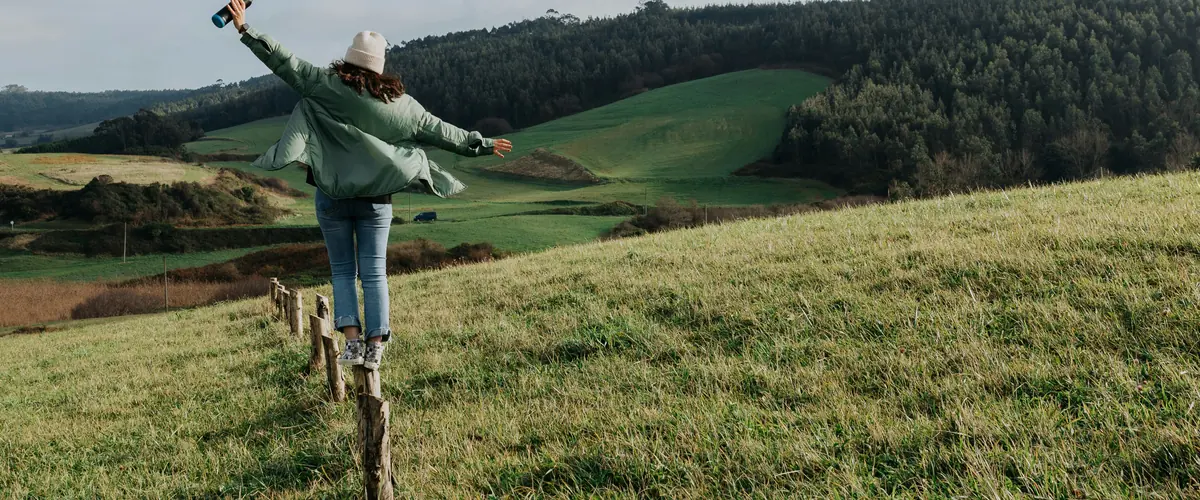UK SRS consultation in reference form — a walker standing open-armed in an open field, the sourced record