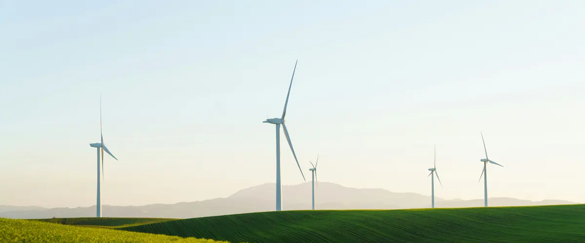 UK SRS consultation — wind turbines at dawn over UK farmland, the bottom line on two closed consultations