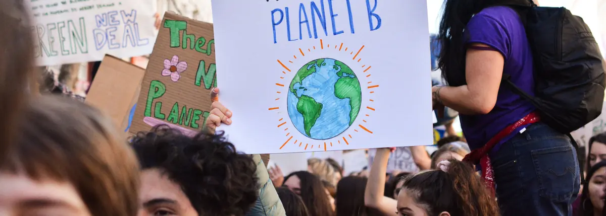 UK SRS timeline next steps &mdash; climate demonstrators with a There Is No Planet B placard